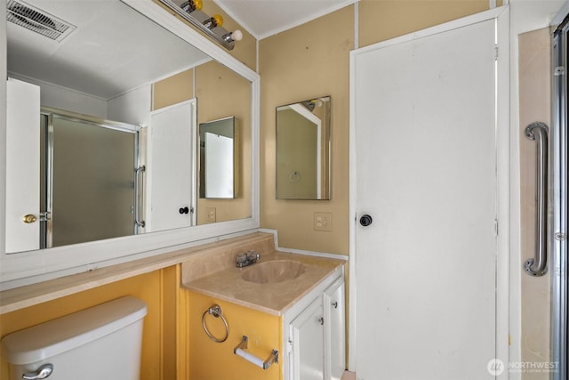 1402 22nd St NE Unit 65, Auburn, WA 98002 - bathroom with vanity, toilet, and an enclosed shower