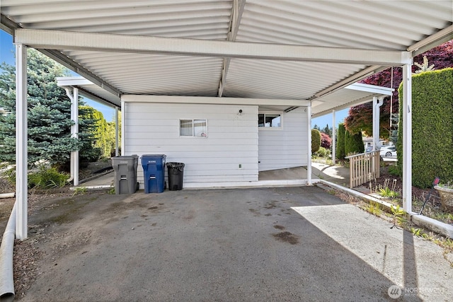 1402 22nd St NE Unit 65, Auburn, WA 98002 - garage with an attached carport