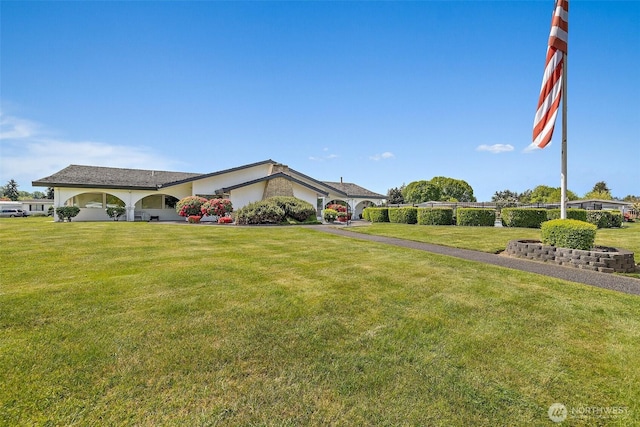 1402 22nd St NE Unit 65, Auburn, WA 98002 - view of green lawn with a garage