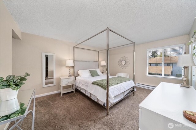 carpeted bedroom with baseboards, a textured ceiling, and baseboard heating