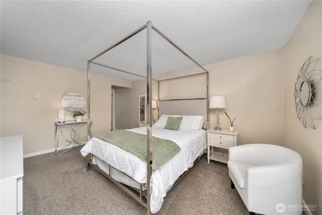 carpeted bedroom with a textured ceiling