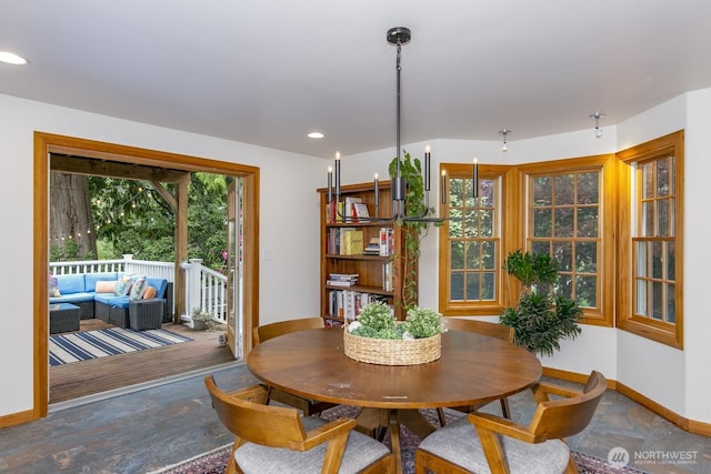 dining area with recessed lighting and baseboards