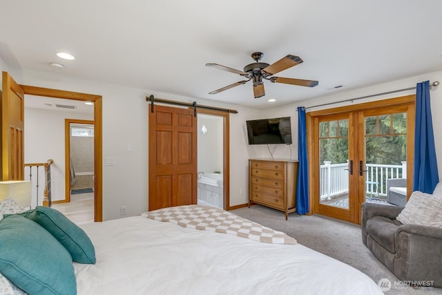 bedroom featuring visible vents, access to exterior, a barn door, french doors, and carpet