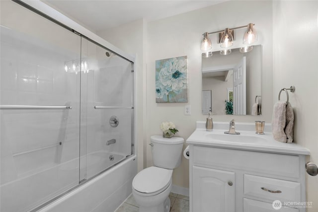 bathroom featuring vanity, tile patterned flooring, toilet, and shower / bath combination with glass door