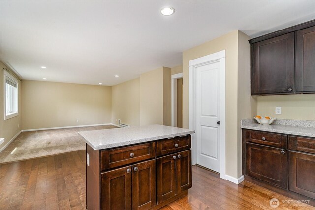 kitchen featuring dark brown cabinets, baseboards, recessed lighting, and dark wood-type flooring