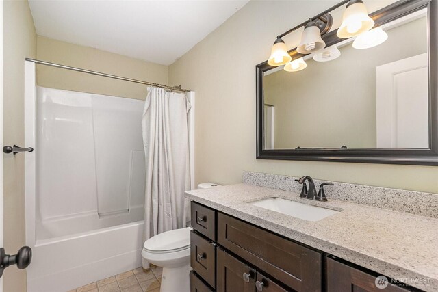 full bathroom with vanity, shower / bathtub combination with curtain, tile patterned floors, and toilet
