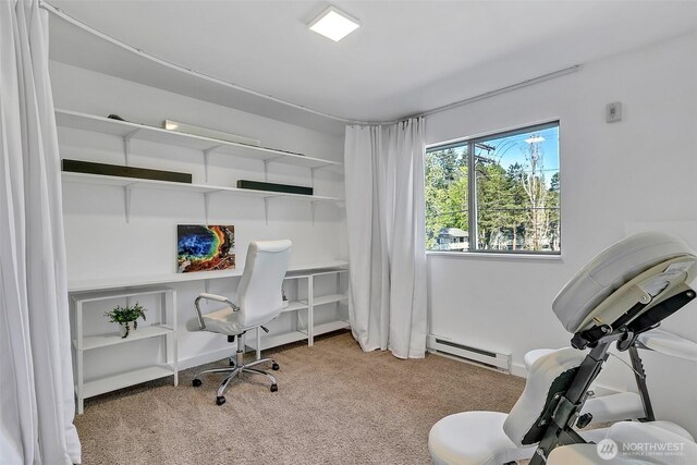 office area with carpet floors and a baseboard heating unit