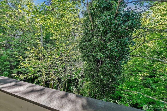 exterior details with a wooded view
