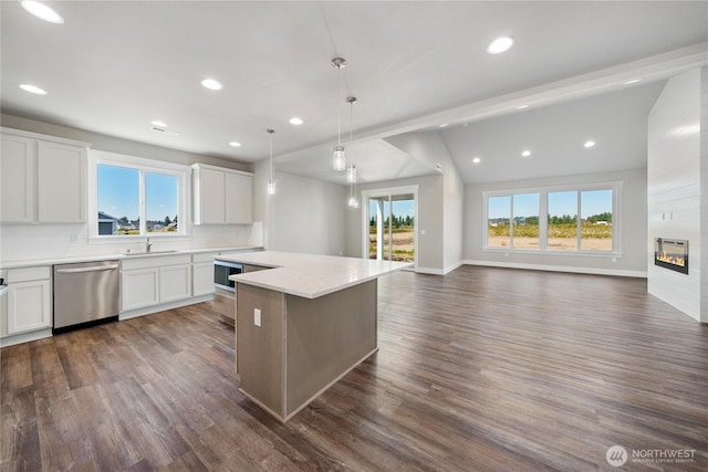 kitchen with a center island, stainless steel dishwasher, dark wood-style floors, open floor plan, and recessed lighting
