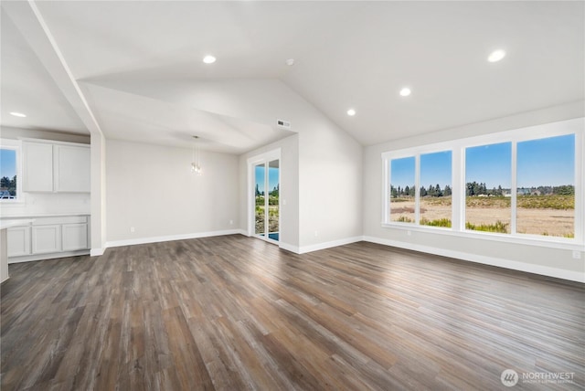 unfurnished living room featuring visible vents, vaulted ceiling, baseboards, recessed lighting, and dark wood-type flooring