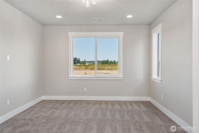 carpeted empty room with recessed lighting, baseboards, visible vents, and a healthy amount of sunlight