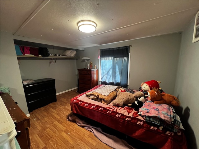 bedroom with wood finished floors