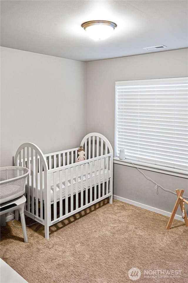 carpeted bedroom with visible vents