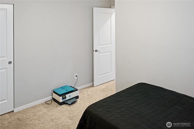 carpeted bedroom with baseboards