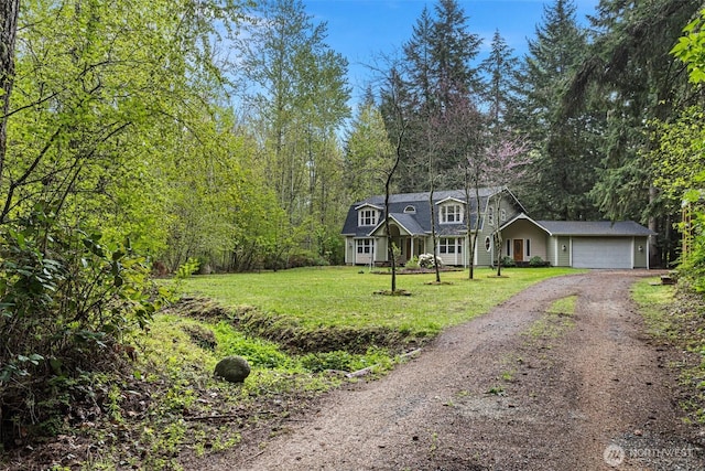 15845 118th Ln SE, Yelm, WA 98597 - new england style home with an attached garage, driveway, and a front yard