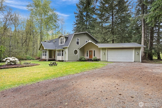 15845 118th Ln SE, Yelm, WA 98597 - view of front of property with a front yard, driveway, roof with shingles, and a garage