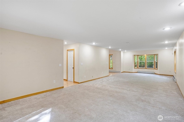 15845 118th Ln SE, Yelm, WA 98597 - empty room with recessed lighting, light colored carpet, and a baseboard radiator