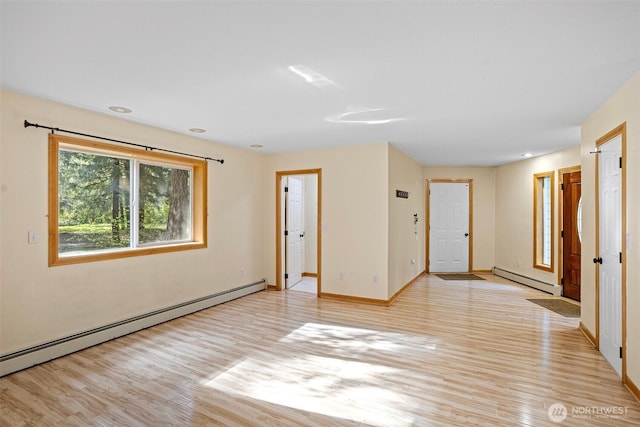 15845 118th Ln SE, Yelm, WA 98597 - empty room with light wood-style floors, baseboards, and baseboard heating