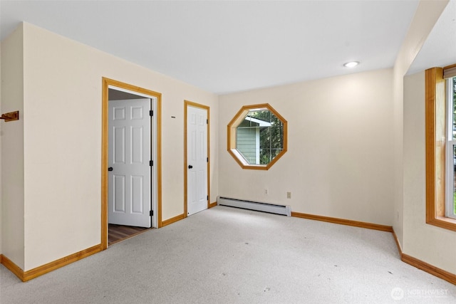 15845 118th Ln SE, Yelm, WA 98597 - carpeted spare room featuring a healthy amount of sunlight, baseboards, and a baseboard heating unit