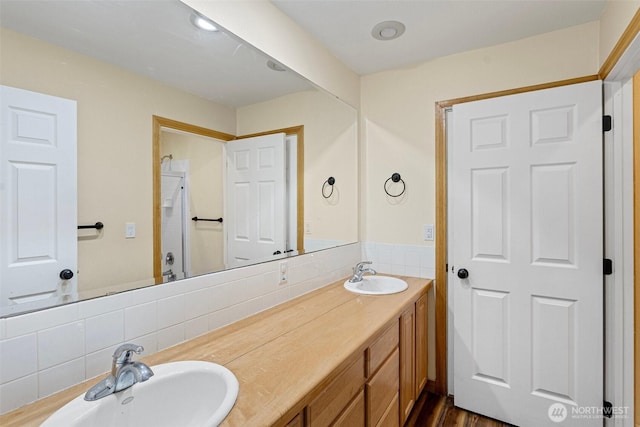 15845 118th Ln SE, Yelm, WA 98597 - bathroom with double vanity, a sink, backsplash, and a shower