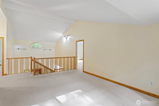 15845 118th Ln SE, Yelm, WA 98597 - carpeted spare room with baseboards and vaulted ceiling with beams