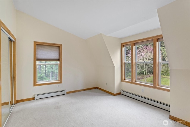 15845 118th Ln SE, Yelm, WA 98597 - bonus room featuring vaulted ceiling, light carpet, baseboard heating, and plenty of natural light