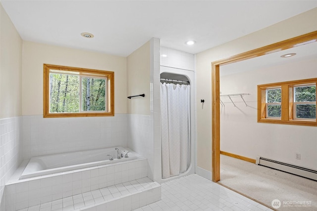 15845 118th Ln SE, Yelm, WA 98597 - bathroom with a baseboard radiator, a bath, curtained shower, and a healthy amount of sunlight