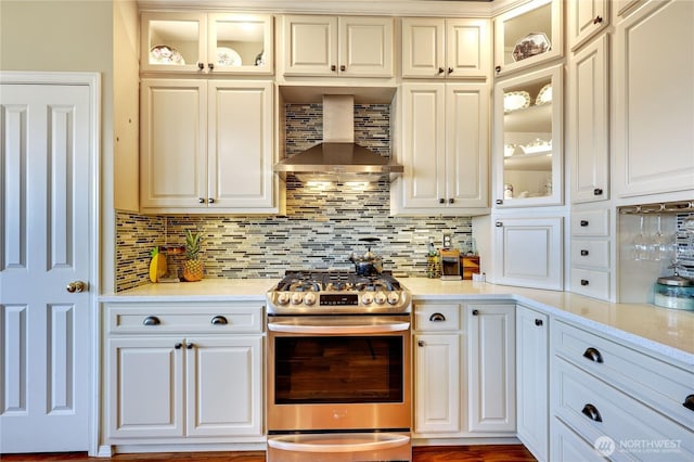 1664 Shine Rd, Port Ludlow, WA 98365 - kitchen featuring stainless steel gas range oven, wall chimney exhaust hood, and white cabinets