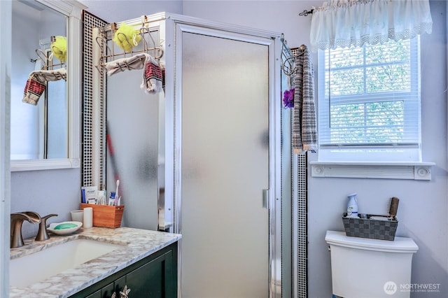 1664 Shine Rd, Port Ludlow, WA 98365 - full bathroom featuring a shower stall, toilet, and vanity