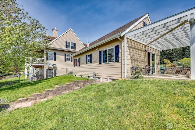 1664 Shine Rd, Port Ludlow, WA 98365 - back of house featuring a pergola, a chimney, and a patio