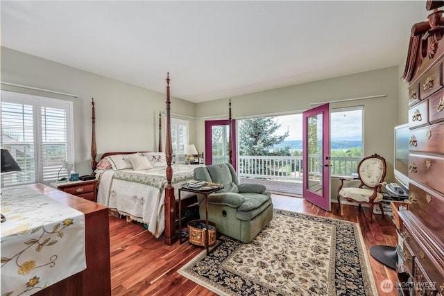 1664 Shine Rd, Port Ludlow, WA 98365 - bedroom featuring access to outside, dark wood-type flooring, and french doors