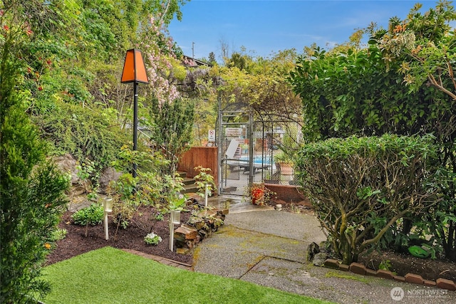 view of yard featuring fence and a gate