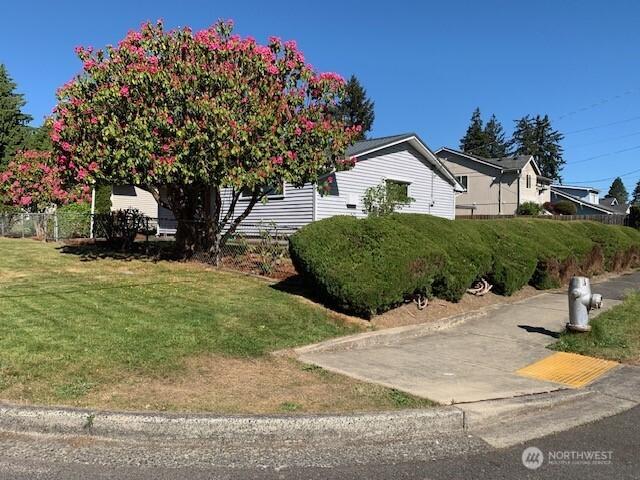 501 S 88th St, Tacoma, WA 98408 - view of property exterior featuring a yard and fence