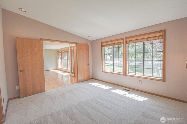 4310 Brookdale Rd E, Tacoma, WA 98446 - carpeted spare room with baseboards and lofted ceiling