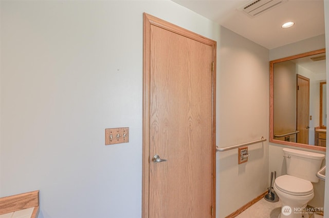 4310 Brookdale Rd E, Tacoma, WA 98446 - bathroom with baseboards, toilet, and recessed lighting