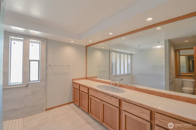 4310 Brookdale Rd E, Tacoma, WA 98446 - full bath with recessed lighting, toilet, vanity, baseboards, and tile patterned flooring