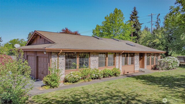 4310 Brookdale Rd E, Tacoma, WA 98446 - back of house featuring a yard, a garage, and roof with shingles