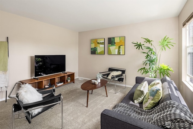 living room with carpet floors and baseboards