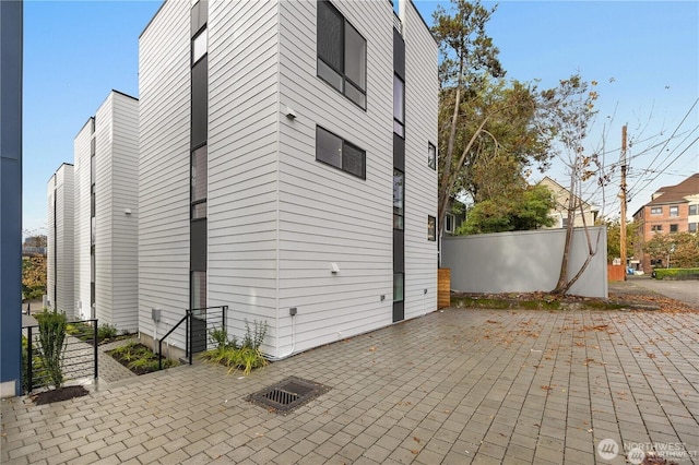 exterior space with fence and a patio area
