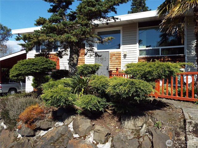 view of property hidden behind natural elements