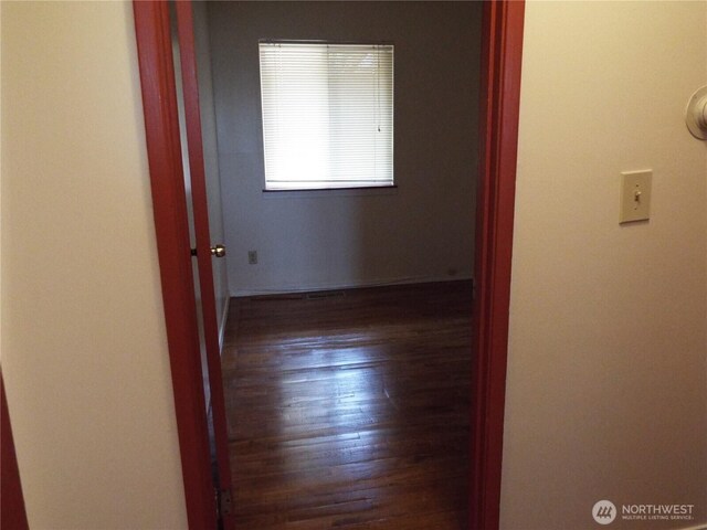 corridor with wood finished floors