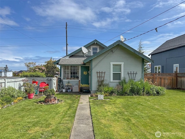 bungalow with a shingled roof