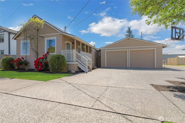 view of front of house with an outdoor structure and a garage