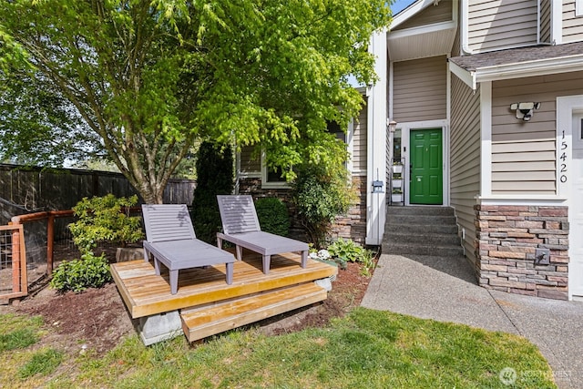 view of yard with fence and a deck