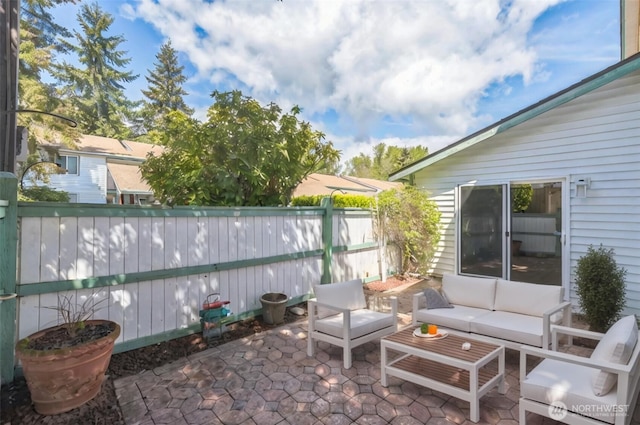 view of patio featuring fence and an outdoor hangout area