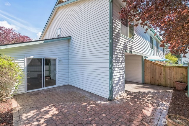 back of house featuring fence and a patio