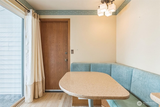 dining area with light wood-style flooring