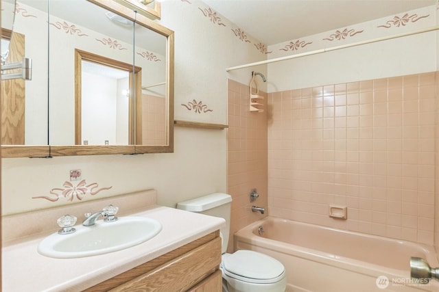 full bathroom featuring vanity, shower / bathing tub combination, and toilet
