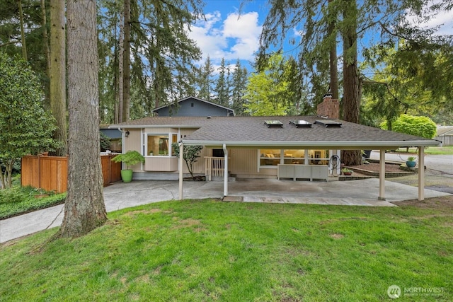 19542 6th Ave NE, Shoreline, WA 98155 - back of property with fence, a chimney, a yard, and a patio area