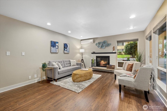 19542 6th Ave NE, Shoreline, WA 98155 - living room featuring a wall mounted air conditioner, a brick fireplace, dark wood finished floors, recessed lighting, and baseboards